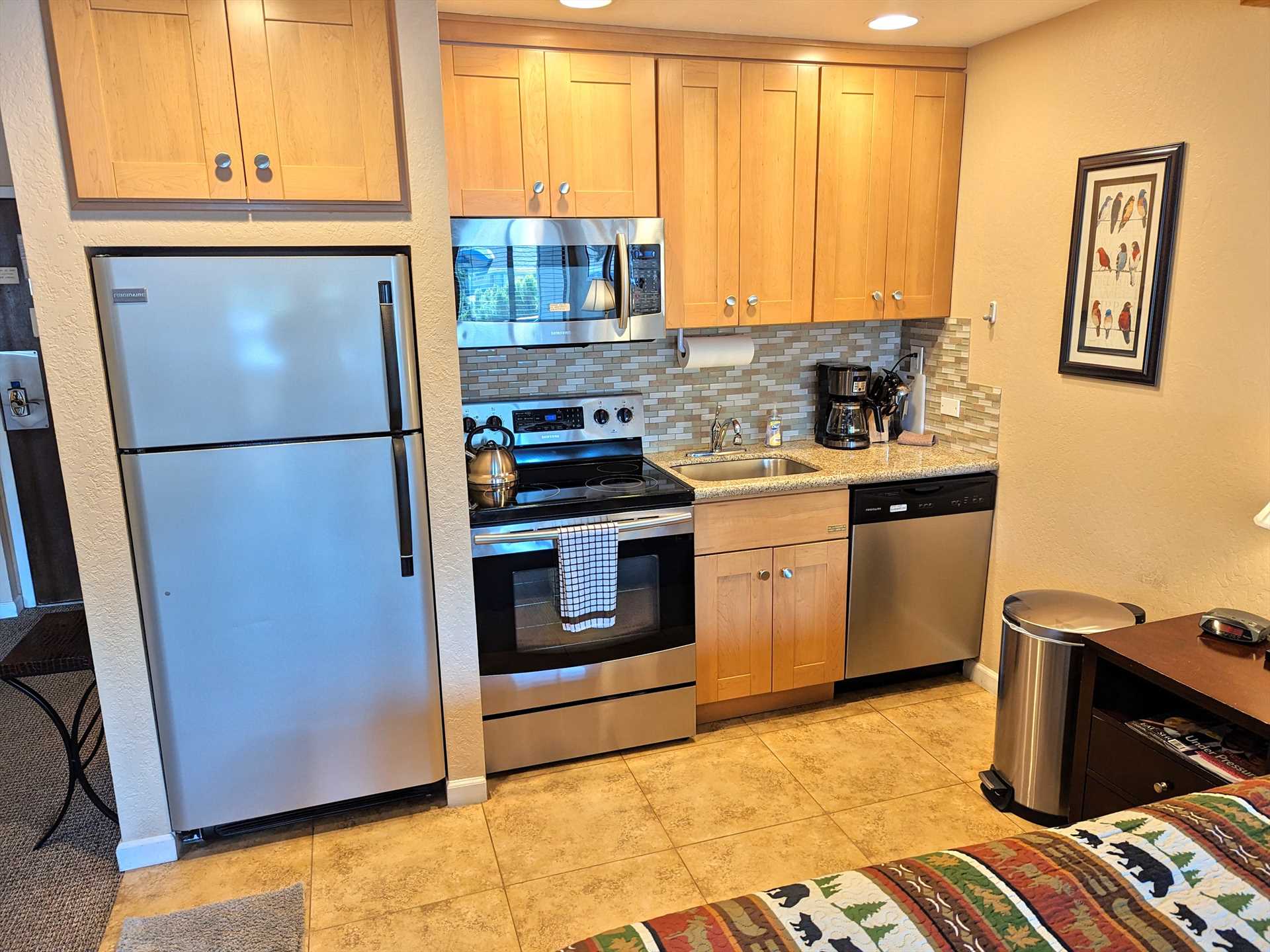 Kitchen with full-size appliances and granite countertop
